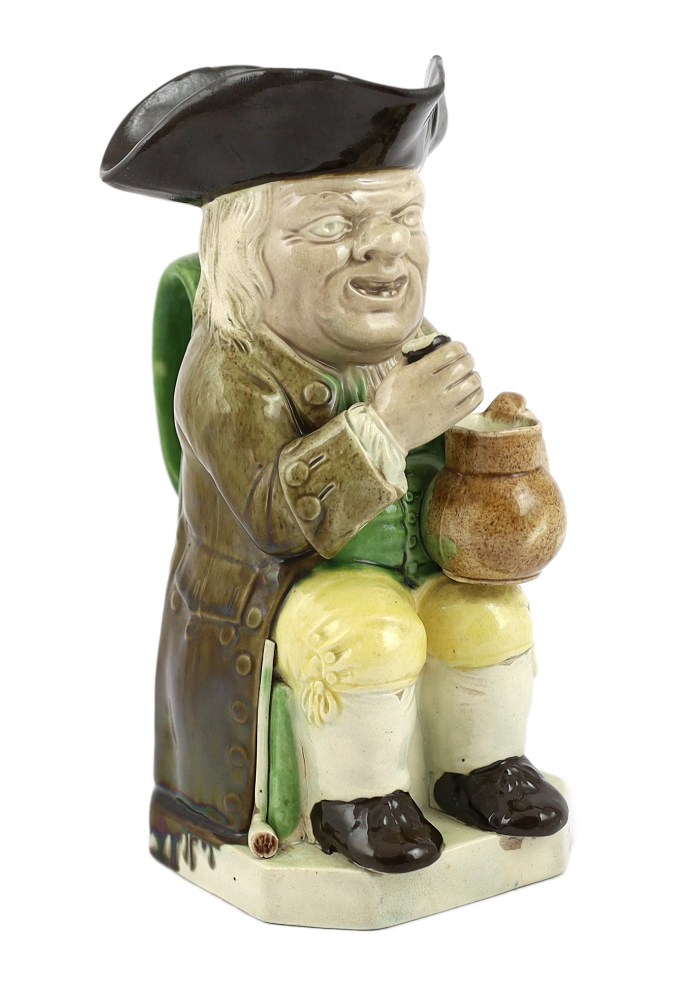 A Ralph Wood type creamware Toby jug of standard type, raising a glass to his lips, c.1790, glaze losses to rim